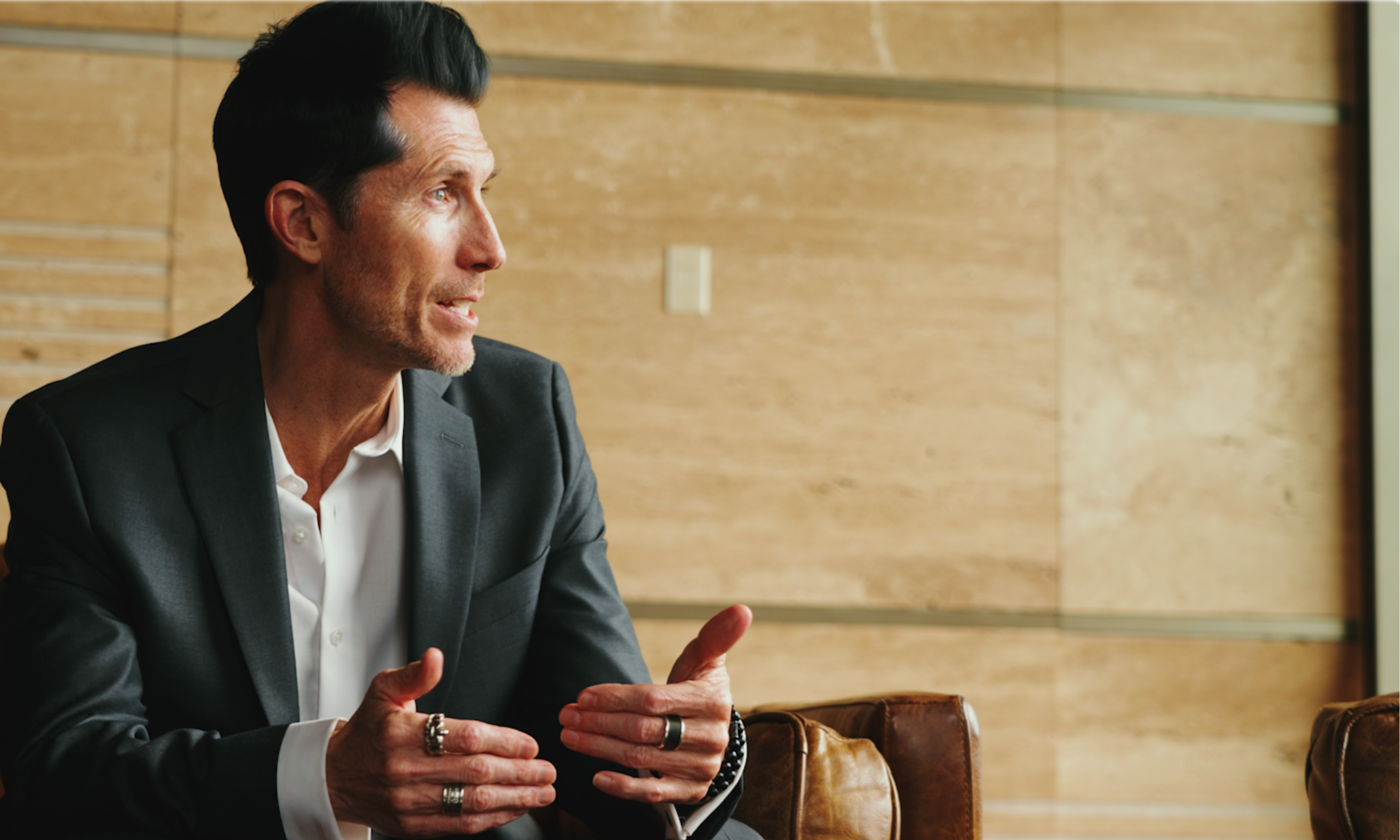 a man sitting speaking off camera