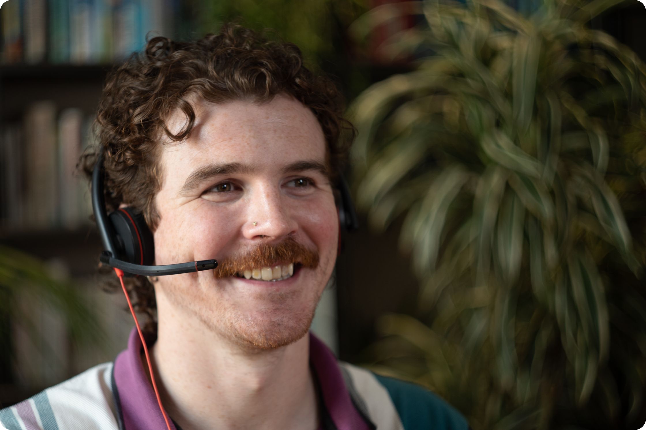 man with headset on, answering call