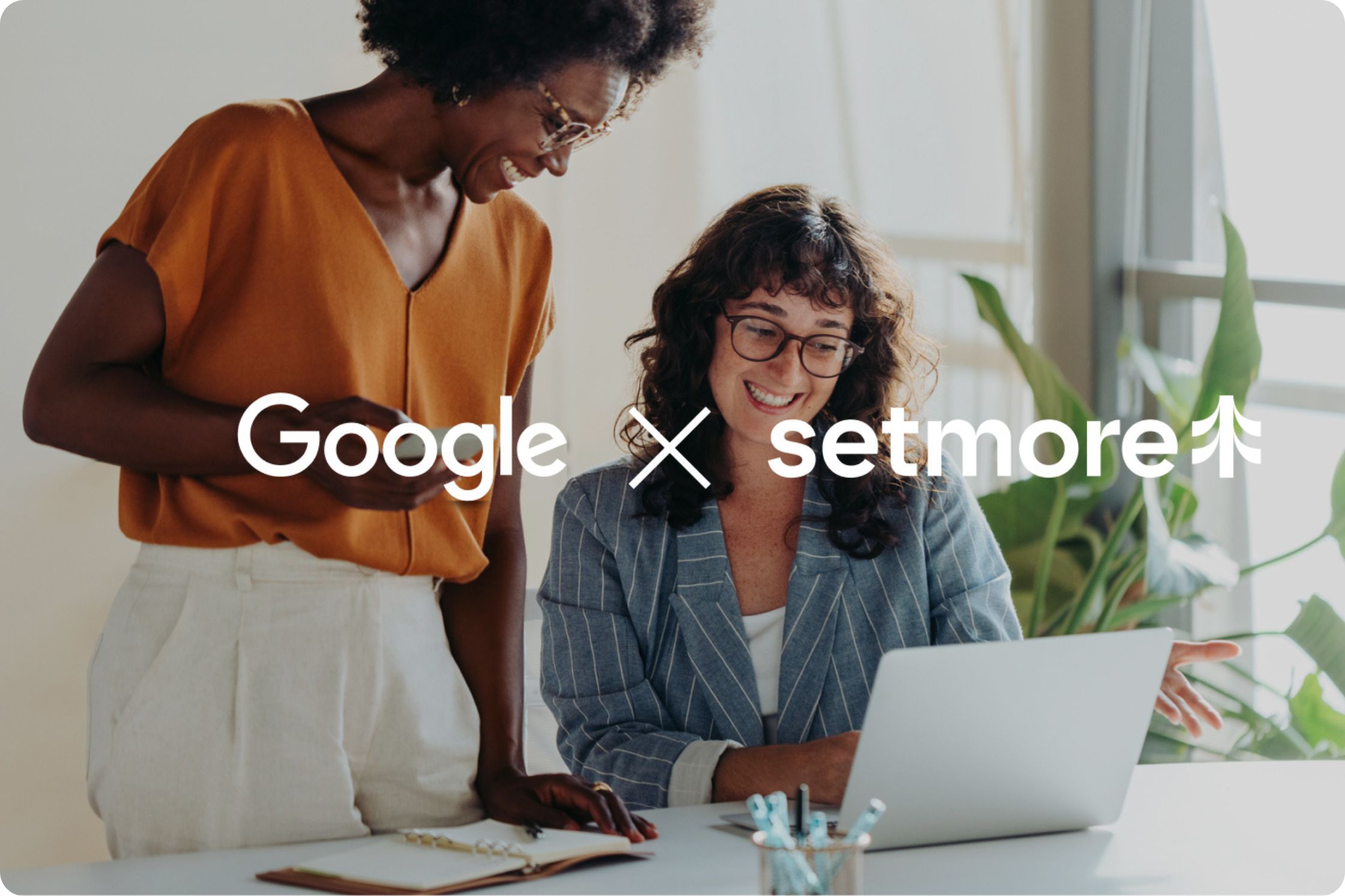 two women, looking at screen, Google X Setmore is in the forefront 