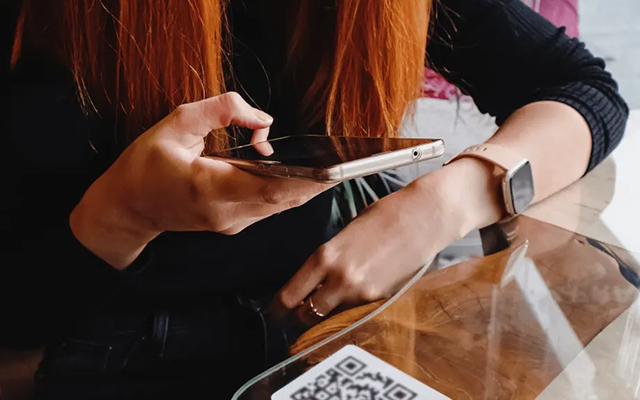 woman scanning a qr code