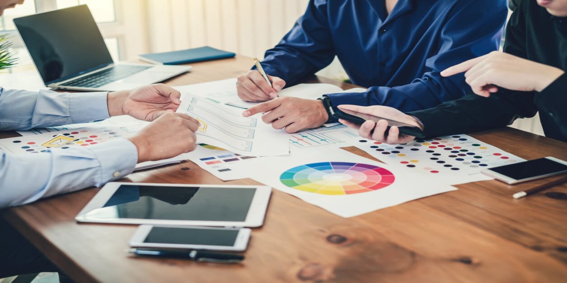 People working with charts on desk