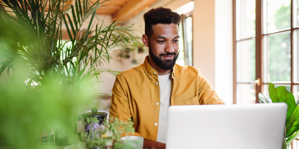 man looking at laptop