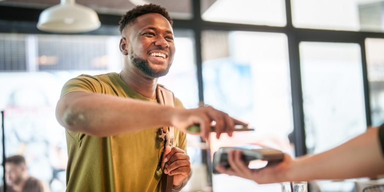 man paying with his phone